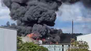 Washington fire LIVE: Updates on huge factory blaze with 'several explosions' heard