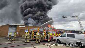Washington fire LIVE: 'Several explosions' as major blaze tears through factory