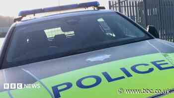 Two arrested as cash and drugs seized in raid