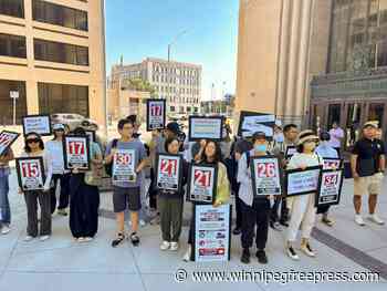 Chinese newcomers protest over delays in security screening clearance