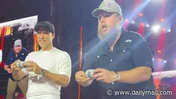 John Terry gets booed as he downs a pint on stage at Luke Combs' gig in London as fans say the surprise appearance was 'awkward'