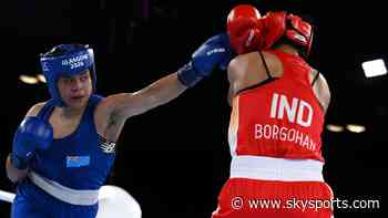 Boxer wins country's first medal without winning a fight