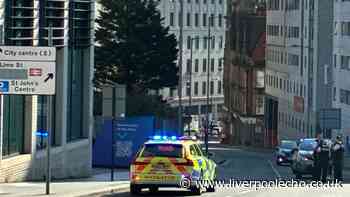 Liverpool city centre road closed as man taken to hospital