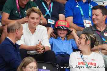 Grinning Prince Louis dons bucket hat as he watches Commonwealth Games alongside family