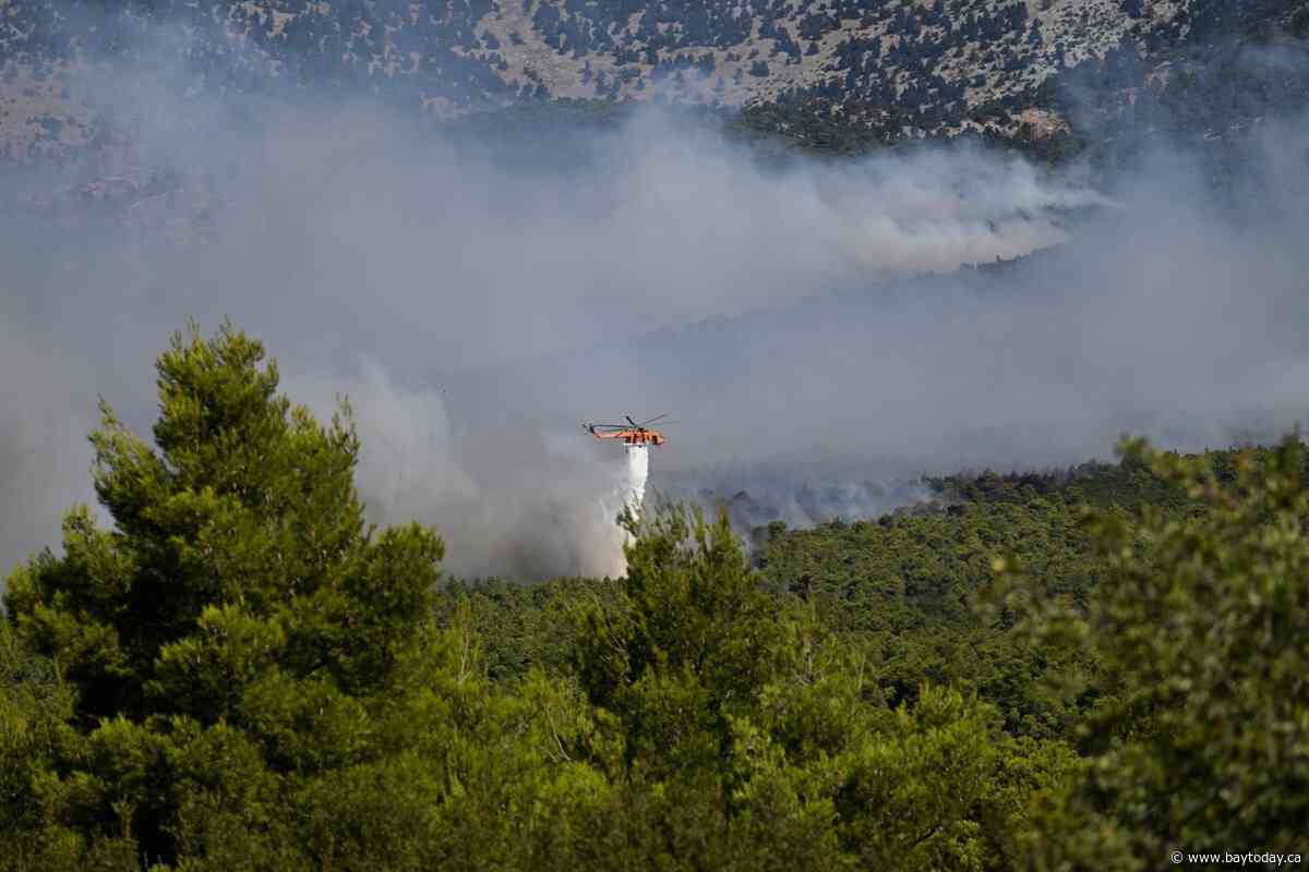 2 firefighting helicopters collide midair near Athens as Europe’s wildfire emergency rages