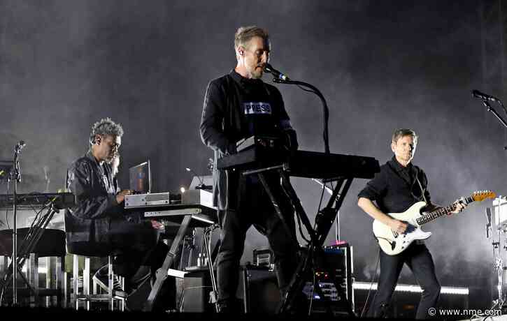 Massive Attack say entire band were detained and some had passports confiscated in Singapore after Palestine flag display