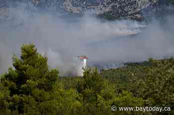2 killed when firefighting helicopters collide near Athens as Europe’s wildfire emergency rages