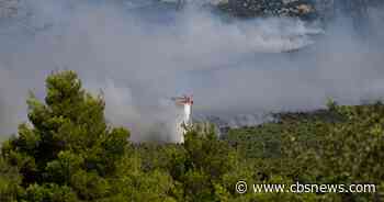 Firefighting helicopters collide in Greece amid European wildfire crisis