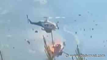 Moment two helicopters collide mid-air while fighting wildfires in Greece - killing two