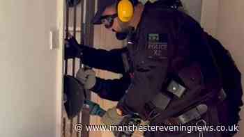 Police carry out raid at Bolton property