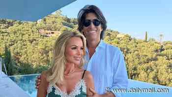 Amanda Holden, 55, showcases her radiant looks as she poses for a rare romantic snap with husband Chris Hughes