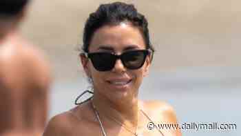 Eva Longoria, 51, is swimsuit season goals in itty bitty bikini as she splashes around the beaches of Spain
