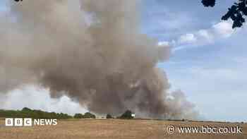 Crews tackle field fire as public told to avoid area