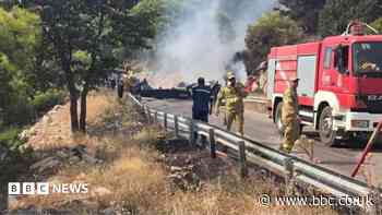 Two crew killed after firefighting helicopters collide in Greece, as British pilot survives