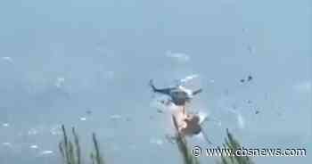2 helicopters collide while putting out fires in Greece