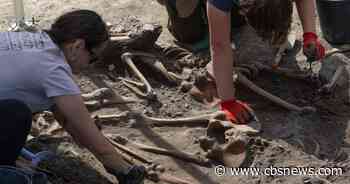 Human remains exhumed at WWII massacre site in Ukraine