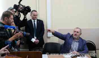 A Putin critic leaves Russia after he is barred him from running for parliament