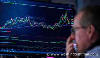 Falling oil prices help calm Wall Street's inflation worries, while chip stocks get back to sinking
