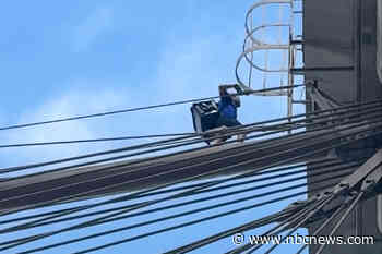 Naked man who jumped off Brooklyn Bridge and survived is arrested and charged