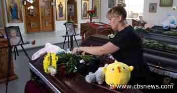 Funeral held for family "wiped off the map" in Russian strike