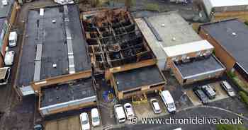 Drone images show aftermath of huge factory blaze in Washington which could be seen for miles