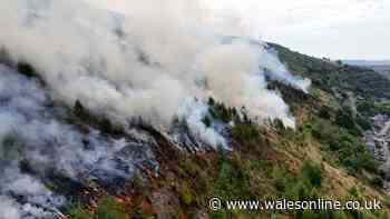 Huge mountain fire brings more heartache for flood-hit community