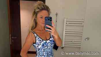 Emily Atack shows off her figure in a blue swimsuit during a couple of days of 'tapas and tantrums' with her fiance Alistair Garner and their son Barney