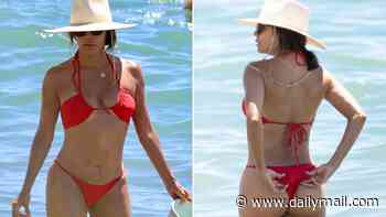 Red hot! Eva Longoria, 51, sizzles in a cheeky thong bikini in Spain... after ditching the US