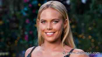 Bachelor star Cass Wood is every inch the Baywatch babe as she announces pregnancy in red swimsuit
