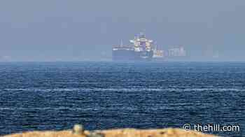 Cargo ship reports being struck in Strait of Hormuz