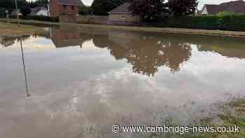 Latest after burst main floods Cambridgeshire road causing 'low water pressure'
