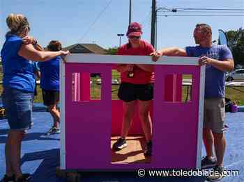 Springfield staff builds a playhouse for a deserving child
