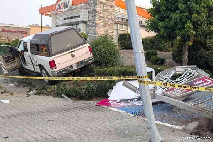 Truck crashes in Abbotsford,  ends up on on top of retaining wall