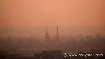 Stay indoors advisories issued in six US states TODAY as wildfire carrying lung-penetrating toxins fills the air