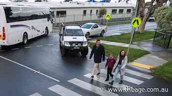 This intersection is so confusing, a school principal directs the traffic himself