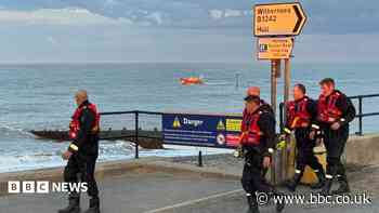 Town's shock as body found in sea search