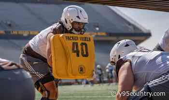 Wyoming's Smiley Samoan Slides Into Potential Starting Role