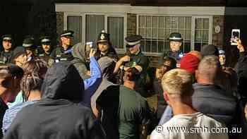 Police injured as protesters descend on homes for asylum seekers in England