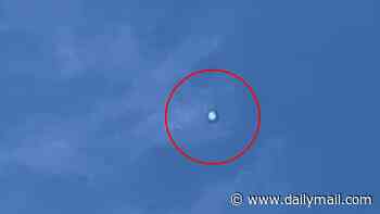 Eerie 'shape-shifting orb' hovers over Colorado for hours... then appears 50 miles away