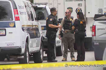 Remains found in yard in search for missing couple, police say son may have left country