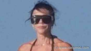 Victoria Beckham, 52, and Kim Turnbull, 25, wear matching tiny black bikinis as shirtless David, 51, tops up his tan on luxury yacht in St Tropez after estranged son Brooklyn's latest social media jibe