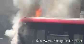 Video shows smoke billowing from bus as fire breaks out on Sutton street