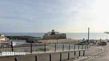 Boy and man drawn out to sea rescued by bystanders