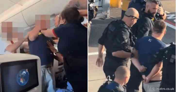 Shocking moment drunk BA passenger fights cabin crew before being arrested at Heathrow