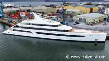 This superyacht makes a splash! £220m mega-vessel with giant swimming pool on board for its 'keen swimmer' owner moors up off South Coast