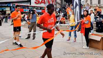 Cambridge 'plagiarism' professor claimed he ran nine marathons with broken leg that 'ballooned to twice the size'... but photos of him at the finish line tell a different story