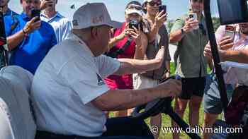 Trump is given a hero's welcome at LIV Golf as he drives golf cart through the crowds to watch Bryson DeChambeau and Co play at his New Jersey course
