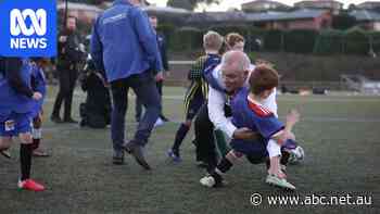Scott Morrison crashes into a child during a campaign stop soccer game