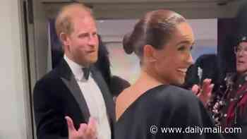 Meghan Markle beams 'my husband loves bagpipes!' as she and Prince Harry arrive at event to support music mogul friend David Foster