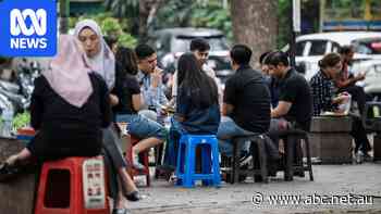 Inside this street food market are signs of a crashing currency